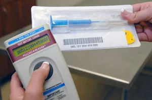 Microchip scanner and implant syringe